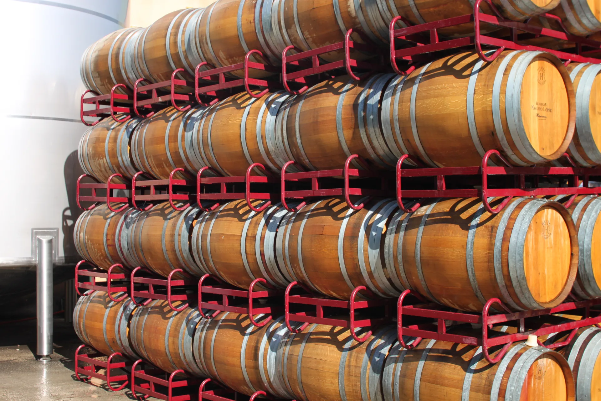 Wine barrels aging in the historic Valdepeñas cellars of Bodegas Crunar